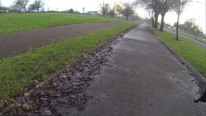 This image shows the cycle track on Durham Road, Sunderland and is image courtesy of Carlton Reid. The tracks are "hidden in plain view" as they can be clearly seen, but nothing indicates they are a cycle track.