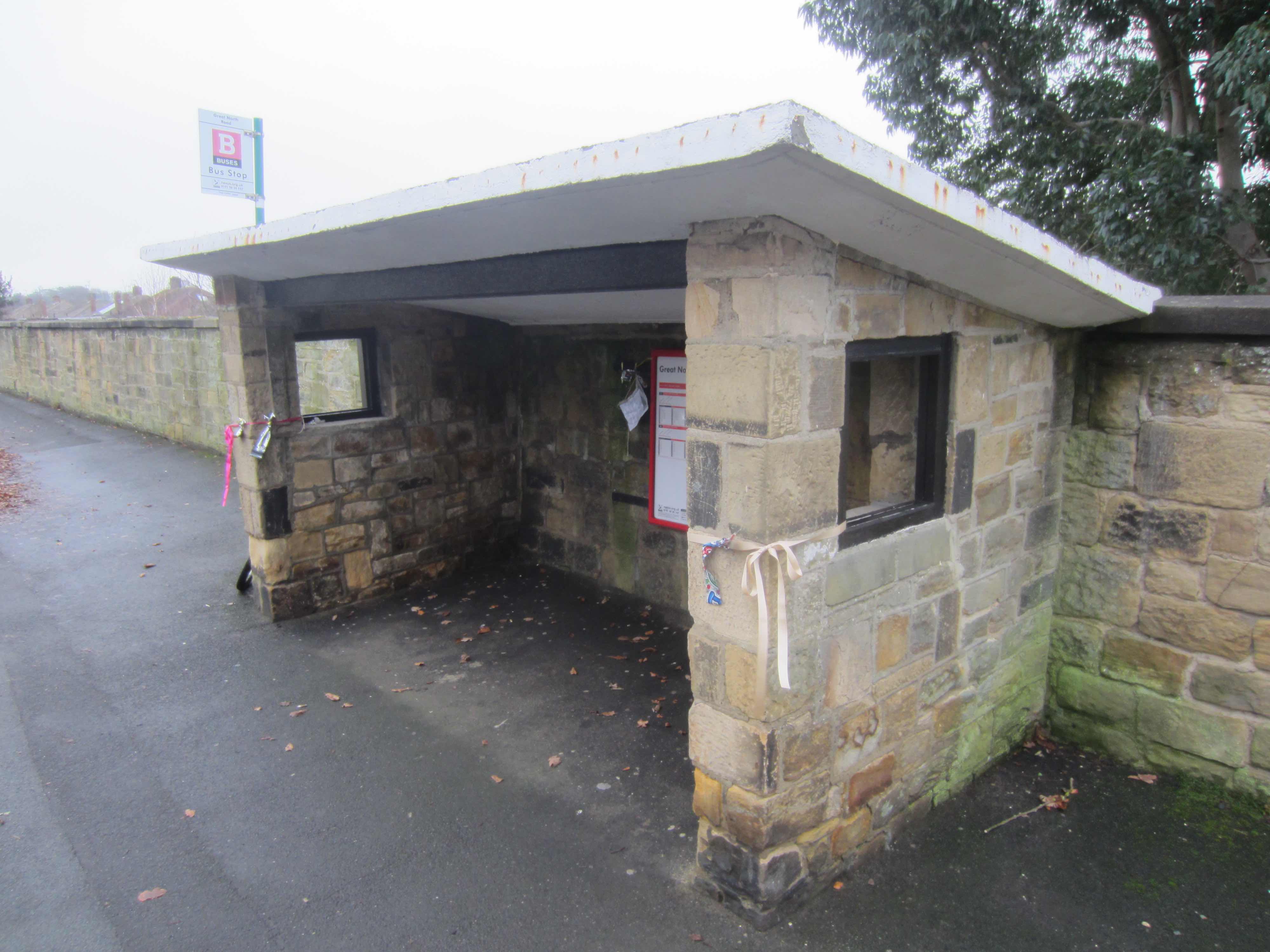 Picture of a stone / concrete bus shelter