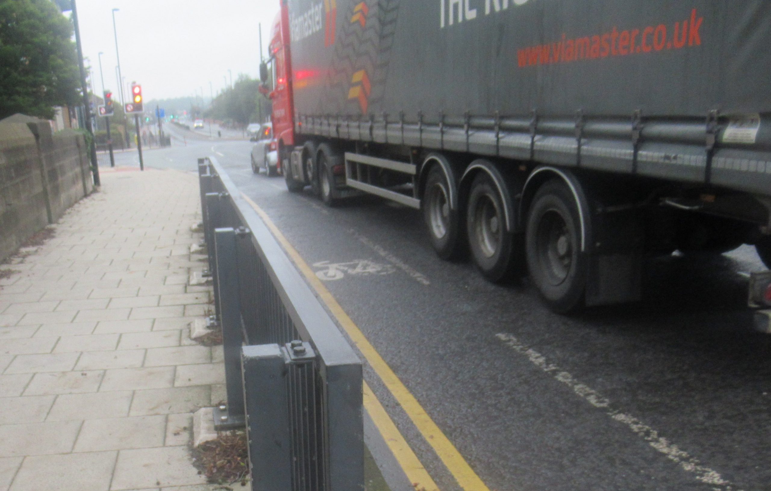 Lorry next to painted cycle lane by Regent Centre heading north
