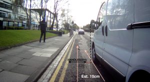 Picture taken from a bike camera showing a close pass