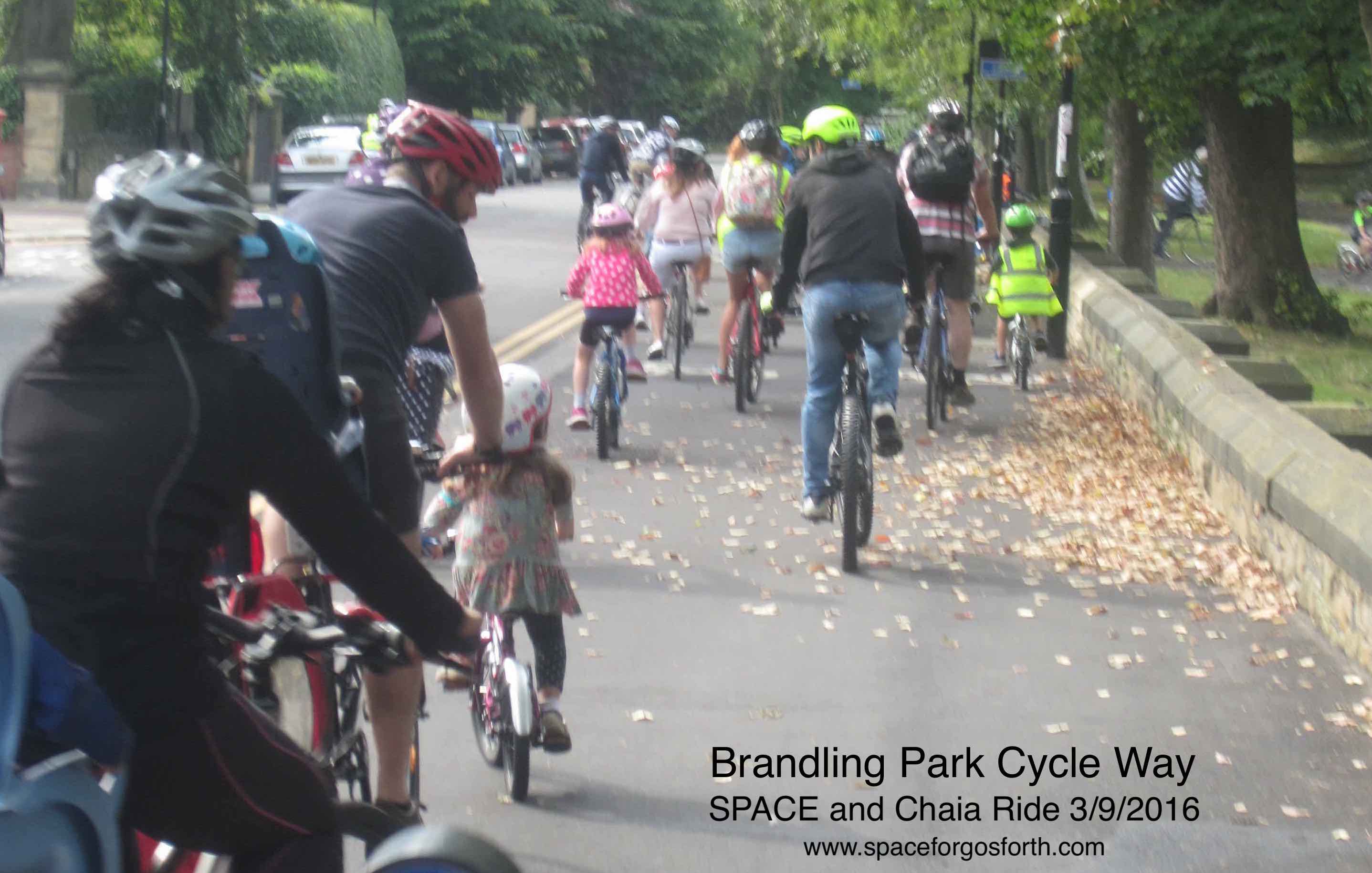 Families cycling along the traffic-free path at Brandling Park in Jesmond.