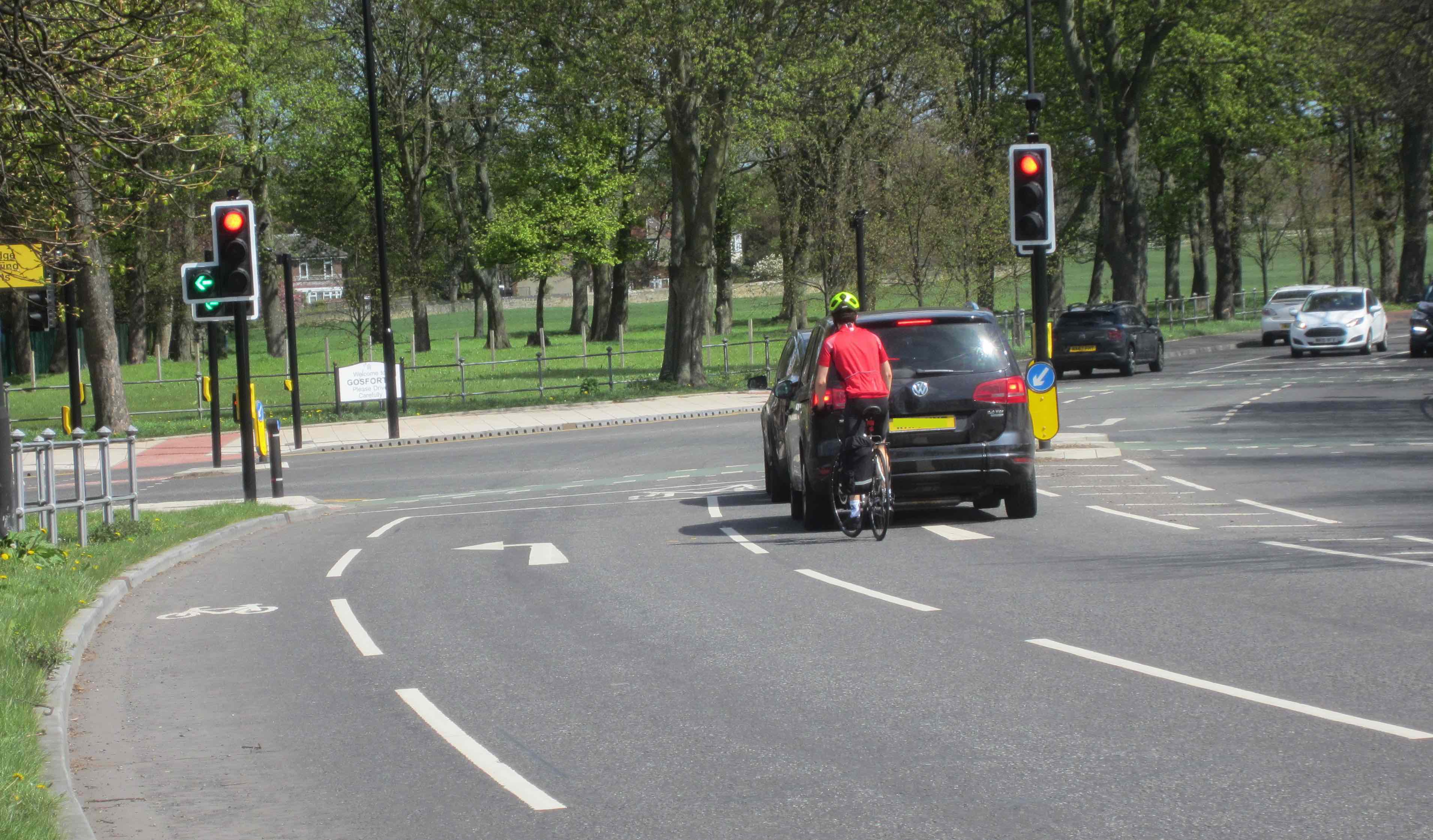 Peron cycling in right hand lane to go straight on at the Kenton Road traffic lights.