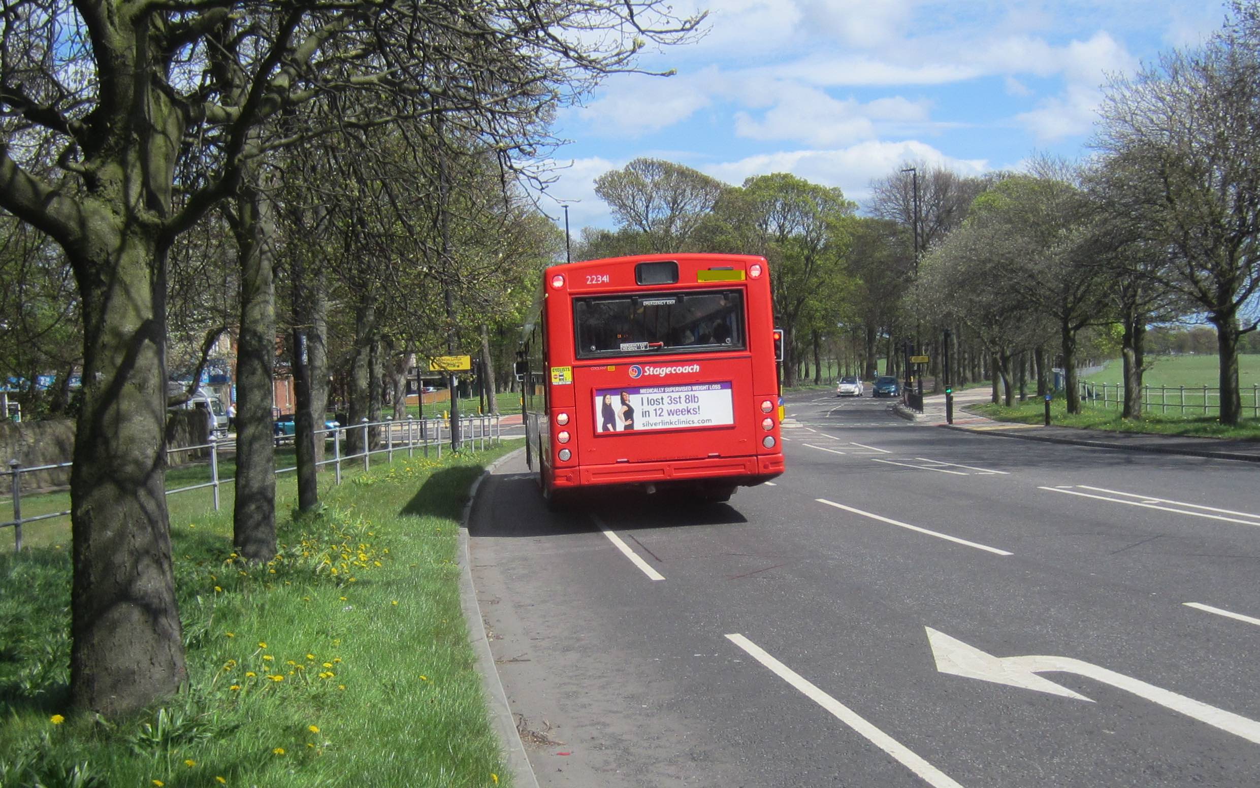 Bus waiting to turn left at the Kenton Road lights stopped partially in the cycle lane.