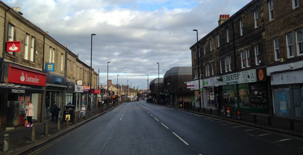 Picture of Gosforth High Street looking north from by Thorpes with no vehicles.