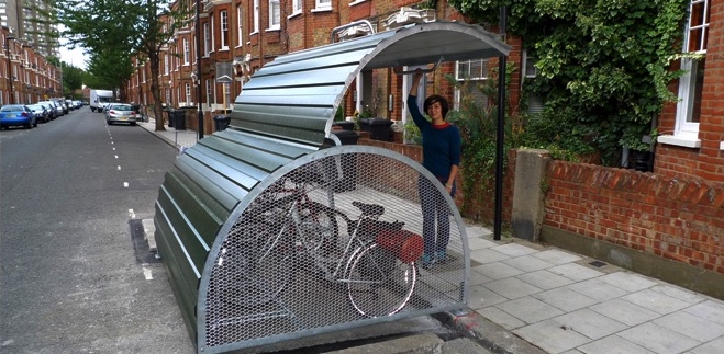 Picture of secure cycle storage instead of a car parking space.