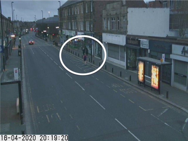 Traffic camera picture of Gosforth High Street with someone running in the road.