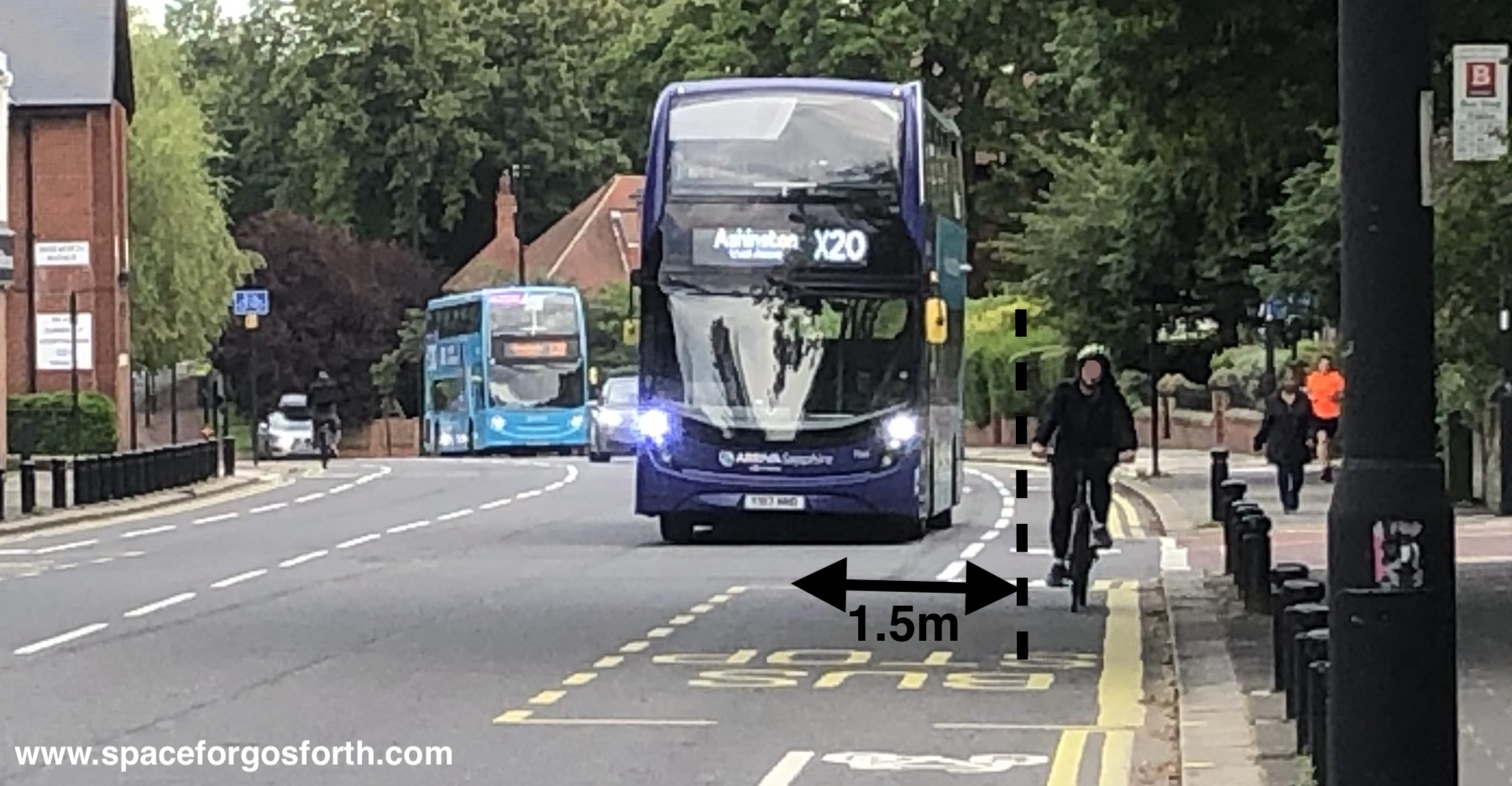 Picture of a bus passing a cyclist on Gosforth High Street