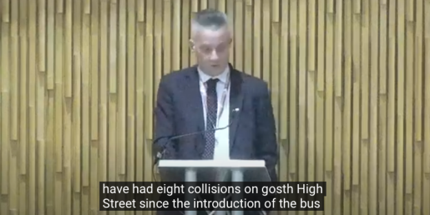 Screenshot from the City Council YouTube recording. Councillor Kemp is responding. Words on screen say "have had eight collisions on Gosforth High Street since the introduction of the bus" lane